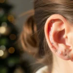 How-to-Design-a-Tiny-Christmas-Sparkle-Ear-Tattoo-That-Looks-Magical.webp